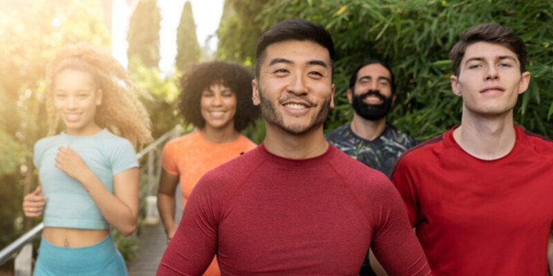 Healthy people smiling and jogging