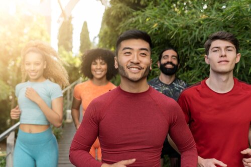 Healthy people smiling and jogging