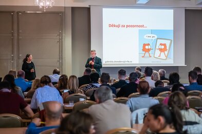 Delegates listen to a presentation