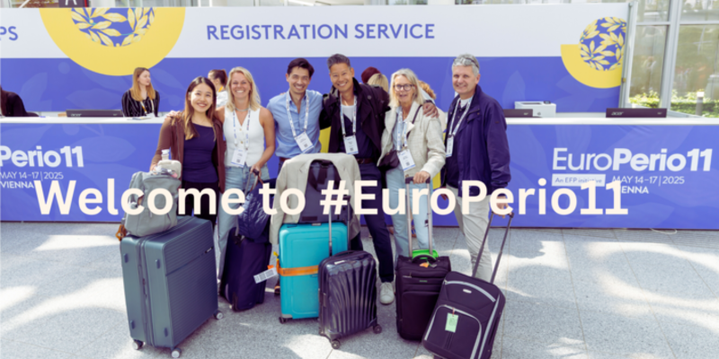 A group of people with suitcases in front of EP11 Registration