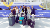 A group of people with suitcases in front of EP11 Registration