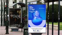 Bus stop with Gum Health Day poster in Greece