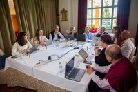 working group of people around table with laptops