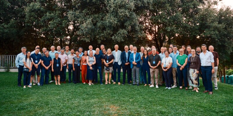 Teachers of programme standing on a lawn
