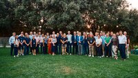 Teachers of programme standing on a lawn