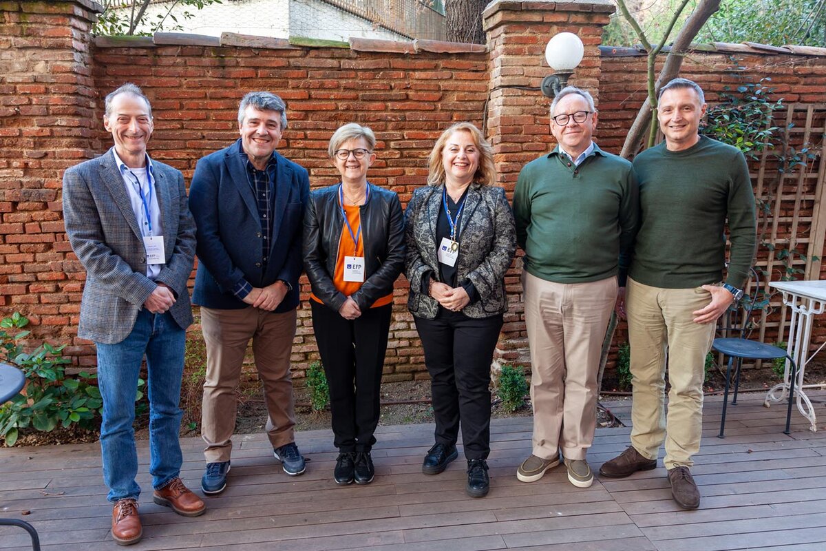 Photo of six people standing, chairs of working groups